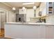 Modern kitchen featuring white cabinets, marble countertops, and stainless steel appliances at 120 Majesty Ln, Fayetteville, GA 30215