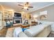 Inviting living room featuring a fireplace, built-in shelving, and comfortable seating at 120 Majesty Ln, Fayetteville, GA 30215