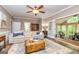 Cozy living room area with comfortable sofa, area rug, and transitional room beyond at 120 Majesty Ln, Fayetteville, GA 30215