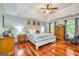 Spacious main bedroom with hardwood floors, tray ceiling, and ample natural light at 120 Majesty Ln, Fayetteville, GA 30215