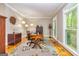 Bright home office with hardwood floors, a large desk, and plenty of natural light at 120 Majesty Ln, Fayetteville, GA 30215