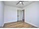 Light-filled bedroom with hardwood floors, ceiling fan, and closet at 130 Belmont Farms Dr, Ellenwood, GA 30294
