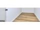 The bedroom has wood floors and white walls at 130 Belmont Farms Dr, Ellenwood, GA 30294