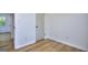 Neutral bedroom with hardwood floors, white walls and light-filled window at 130 Belmont Farms Dr, Ellenwood, GA 30294