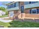 Inviting brick stairs to a front door and attached garage of a newly renovated home at 130 Belmont Farms Dr, Ellenwood, GA 30294