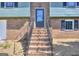 Brick staircase leading to the front door, showcasing the brick facade of the house at 130 Belmont Farms Dr, Ellenwood, GA 30294