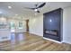 Open-concept living space with modern finishes, wood-look flooring, and natural light, perfect for entertaining at 130 Belmont Farms Dr, Ellenwood, GA 30294