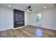 Spacious living room featuring a modern fireplace, recessed lighting, and wood-look floors at 130 Belmont Farms Dr, Ellenwood, GA 30294