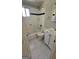 Bathroom featuring white tiled walls, a bathtub and shower combination, and white vanity with sink at 1973 Niskey Lake Sw Rd, Atlanta, GA 30331