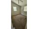 Neutral bedroom featuring neutral walls, carpet flooring, and natural light from two windows at 1973 Niskey Lake Sw Rd, Atlanta, GA 30331