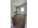 A bedroom featuring neutral walls, brown carpet and a built in desk next to a window at 1973 Niskey Lake Sw Rd, Atlanta, GA 30331