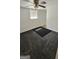A carpeted basement bedroom with concrete walls, a fan, and a small window for natural light at 1973 Niskey Lake Sw Rd, Atlanta, GA 30331