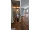 Hallway with bamboo flooring leads to various rooms, offering a seamless flow and access throughout the home at 1973 Niskey Lake Sw Rd, Atlanta, GA 30331