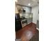 A modern kitchen featuring stainless steel appliances, gray cabinets, and a stylish backsplash at 1973 Niskey Lake Sw Rd, Atlanta, GA 30331