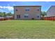 Expansive backyard with vibrant green grass and a fence, perfect for outdoor activities at 237 Cranapple Ln, Mcdonough, GA 30253
