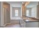 Bright bathroom with double vanity, soaking tub, and glass shower enclosure at 237 Cranapple Ln, Mcdonough, GA 30253