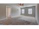 Bedroom with carpeted floors, neutral walls, and two windows at 237 Cranapple Ln, Mcdonough, GA 30253