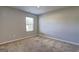 Neutral bedroom featuring plush carpeting and a window providing natural light at 237 Cranapple Ln, Mcdonough, GA 30253