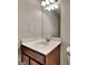 Bathroom featuring a white vanity with storage and a large mirror with modern lighting at 3733 Upland Dr, Mcdonough, GA 30253