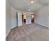 Neutral bedroom with two entry doors, and plush carpet at 3733 Upland Dr, Mcdonough, GA 30253