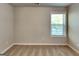 Cozy bedroom with neutral walls, plush carpet, and a large window offering natural light at 3733 Upland Dr, Mcdonough, GA 30253