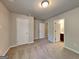 Bedroom featuring neutral walls, plush carpet, and two entry doors at 3733 Upland Dr, Mcdonough, GA 30253