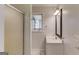 Bathroom featuring a stand up shower, vanity and natural light at 5284 Silver Creek Sw Dr, Lilburn, GA 30047
