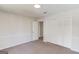 Bedroom with a closet and open door with neutral walls and carpeting at 5284 Silver Creek Sw Dr, Lilburn, GA 30047