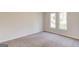 Neutral bedroom with carpet floors and natural lighting at 5284 Silver Creek Sw Dr, Lilburn, GA 30047