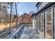 Exterior view of a spacious wooden deck with seating and backyard views at 5284 Silver Creek Sw Dr, Lilburn, GA 30047