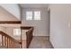 Hallway featuring neutral colors with carpet, natural wood and multiple windows for natural light at 5284 Silver Creek Sw Dr, Lilburn, GA 30047