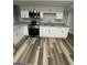 Updated kitchen featuring stainless steel appliances, white cabinets, and granite counters at 5284 Silver Creek Sw Dr, Lilburn, GA 30047