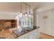 Kitchen island with cooktop and eat in breakfast area, surrounded by natural light at 5284 Silver Creek Sw Dr, Lilburn, GA 30047