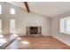 Bright and airy living room showcases hardwood floors, a stone fireplace, and ample natural light at 5284 Silver Creek Sw Dr, Lilburn, GA 30047