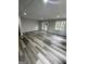 Open living area with recessed lighting, and large windows at 5284 Silver Creek Sw Dr, Lilburn, GA 30047
