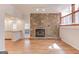 Spacious living room with a stone fireplace and access to the outdoor patio at 5284 Silver Creek Sw Dr, Lilburn, GA 30047