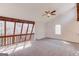 Upstairs loft with neutral carpet and multiple windows offering plenty of natural light at 5284 Silver Creek Sw Dr, Lilburn, GA 30047