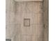 Updated shower featuring gray tile and modern fixtures at 5284 Silver Creek Sw Dr, Lilburn, GA 30047