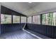 A cozy sunroom with multiple windows, offering a bright and airy space at 5284 Silver Creek Sw Dr, Lilburn, GA 30047