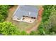 Aerial view of the home and expansive yard and mature trees at 563 Deadwood Trl, Locust Grove, GA 30248