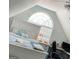 Finished attic bedroom with dormer window, bed, and desk at 563 Deadwood Trl, Locust Grove, GA 30248