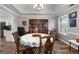 Formal dining room with chandelier, trey ceiling, and classic furnishings at 563 Deadwood Trl, Locust Grove, GA 30248