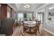 Dining room with hardwood floors, hutch, and view to entry at 563 Deadwood Trl, Locust Grove, GA 30248