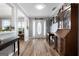 Welcoming foyer with a beautiful front door, hardwood floors, and classic furnishings at 563 Deadwood Trl, Locust Grove, GA 30248