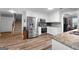 Modern kitchen featuring stainless steel appliances, granite countertops, and ample storage space at 563 Deadwood Trl, Locust Grove, GA 30248