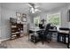Well-organized office with laminate floors, ceiling fan and lots of natural light at 563 Deadwood Trl, Locust Grove, GA 30248