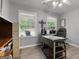 Bright office space with lots of natural light, neutral paint, and hardwood floors at 563 Deadwood Trl, Locust Grove, GA 30248