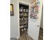 Walk-in pantry with wire shelving and organized food storage at 563 Deadwood Trl, Locust Grove, GA 30248