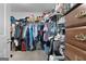 Walk-in closet with lots of storage racks and hanging space for clothes and accessories at 563 Deadwood Trl, Locust Grove, GA 30248