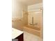 Bathroom featuring a tub with tile surround, and ample space for toiletries and bath essentials at 6576 Randall Mark Dr, Morrow, GA 30260